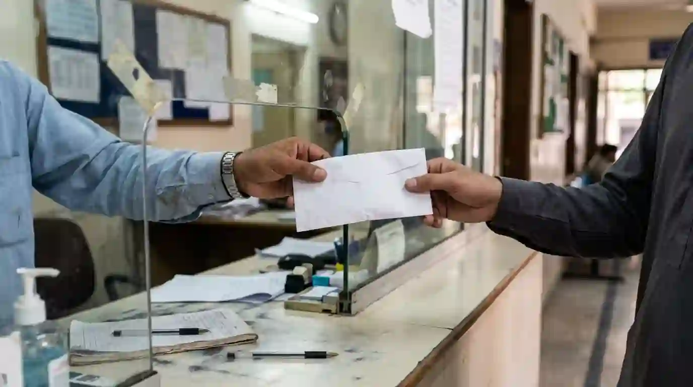 An estimate being handed across a clinic counter